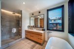 Lavish bathroom with steam shower and/or soaker tub